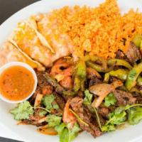 Beef Or Chicken Fajitas · Served with Rice, Beans, and your Choice of Tortilla.