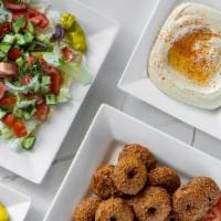 Family Veggie Meal Special · Vegan falafels with veggies and tahini Mediterranean salad and a side of hummus, baba ghanou...