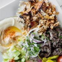 Mixed Gyro Plate · Thinly carved marinate chicken & beef cooked on a vertical broiler served with rice, hummus,...