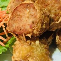 Crab Cakes · Deep fried marinated crab meat with ground pork and shrimp, served with sweet and sour sauce.