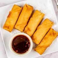Thai Egg Rolls · crispy-fried & stuffed with cabbage, and carrots, served with a sweet & sour sauce