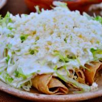 Flautas · Served with rice and beans