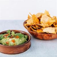 **Guacamole · Avocado, cilantro, tomato, onion and lime juice served with homemade tortilla chips