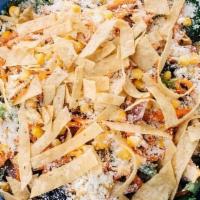 *Casero Greens · Mixed Greens with roasted corn, pickled onions, carrots, cotija cheese and tortilla strips. ...