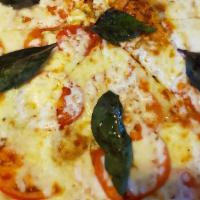 Margarita Pizza · Roma tomatoes, garlic, fresh basil, mozzarella cheese, and pizza sauce.