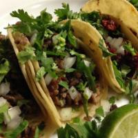 Tacos · Onions, cilantro.
Green and Red Salsa will be included in container.