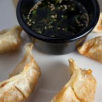 Gyoza · Choose from pan fried or deep fried. Served with sesame-soy vinaigrette.