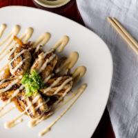 Bbq Albacore White · Quick-seared albacore on a bed of sautéed white onions and drizzled with our housemade white...