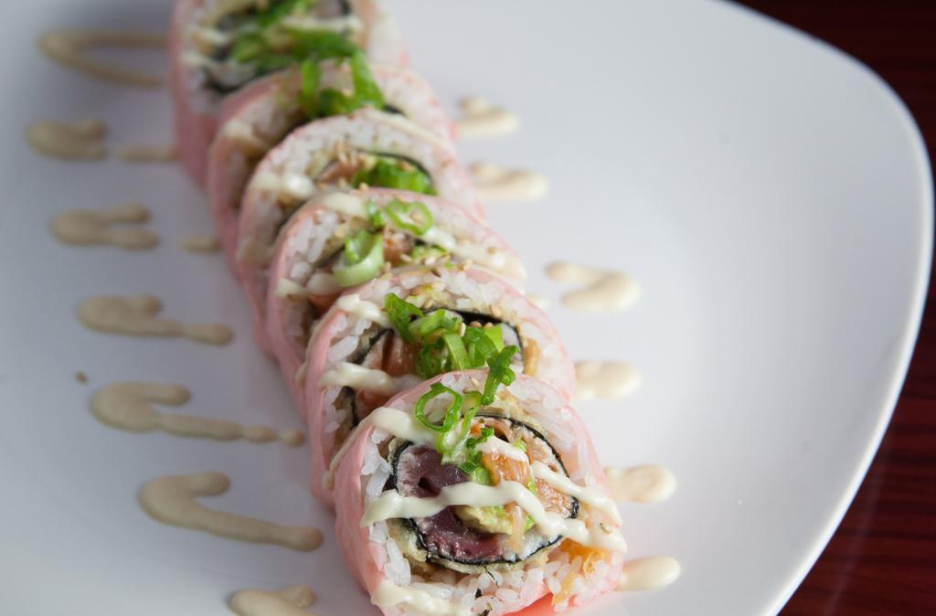 Tyler & Riley · Maguro (tuna), sake (salmon), hamachi (yellowtail), shiro maguro (albacore) and avocado deep-fried and rolled with rice in soy paper. Finished with garlic miso, ponzu, green onion, and sesame seeds.