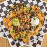 Ultimate Thrash Metal Nachos · Add chicken, chorizo, or steak for an additional charge.