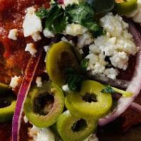 Lamb Meatballs · Spicy marinara, feta, green olives, cilantro, hummus & red onions.