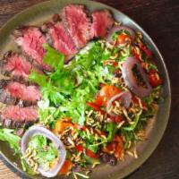 Mediterranean Steak Salad · Gluten free,vegetarian. Grilled hanger steak, jalapeno feta spread, marinated peppers, kalam...