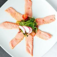 Seared Salmon Sashimi · Seven pieces of thinly sliced salmon topped with cilantro, black pepper, sesame seeds, and s...