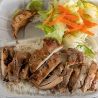 Grilled Chicken Combo · Grilled chicken over a bed of rice. Comes with a fried pork potsticker, side salad with Asia...