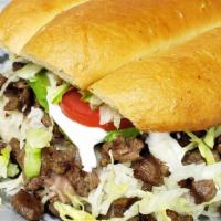 Torta · Mexican sandwich, choice of meat, telera bread, beans, onions, lettuce, cheese, sour cream a...