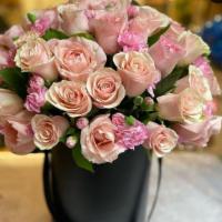 Pink Roses On A Bucket · Comes with 36 pink roses with a black bucket.