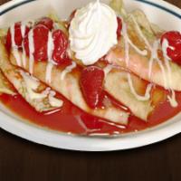 King'S Cheese Blintzes · Three crepes filled with cheese and choice of strawberry or blueberry topping with sour crea...