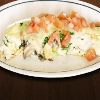 Egg White Omelette · Made with egg whites and filled with tomatoes, spinach, mushrooms, onions, swiss cheese. top...