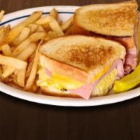 Breakfast Sandwich · Sourdough bread filled with scrambled eggs, ham and american cheese.