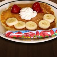 Happy Face Pancake · One pancake with bananas, strawberries, whipped cream and yogurt.