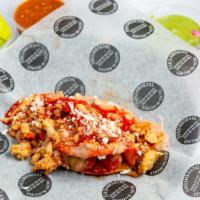 Jalisco Taco · Choice of meat, deep fried potato taco, refried beans, orange, and red sauce.