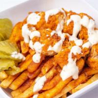 Nashville Hot Fries · French fries topped with chicken strips, Nashville hot sauce, ranch drizzle and pickles.