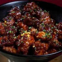Orange Chicken · Fried chicken thigh, house orange sauce, dried chiles, chives. Served with side of steamed w...
