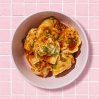 Spicy Wontons · Eight spicy wontons with dipping sauce.