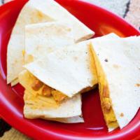 Breakfast Quesadilla · A large flour tortilla lightly grilled and folded with melted cheese, two scrambled eggs and...