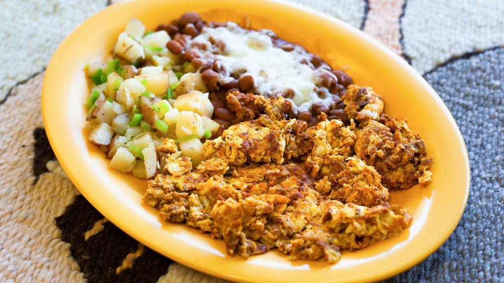 Huevos Chorizo Plate · Two eggs scrambled with chorizo (Mexican sausage) and cheese. Served with potatoes, beans, and choice of flour or corn tortillas.