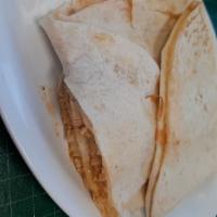 Quesadilla · A large flour tortilla stuffed with jack cheese and guacamole, then topped with Chile verde ...