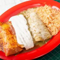 Tres Enchiladas · Three enchiladas - shredded beef, chicken, and cheese -  each covered with a different sauce...