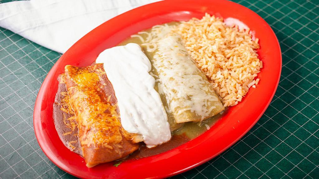 Tres Enchiladas · Three enchiladas - shredded beef, chicken, and cheese -  each covered with a different sauce: red enchilada sauce, green suizas sauce, and sour cream . Topped with jack and cheddar cheeses and served with Mexican rice.