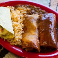 Grandes · Your choice of any three items served with rice and pinto beans.