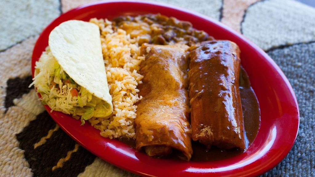 Grandes · Your choice of any three items served with rice and pinto beans.
