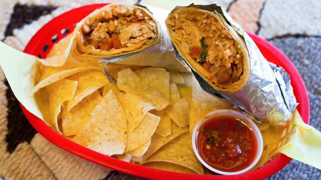 #6. Chicken Machaca · Boneless and skinless chicken simmered with tomatoes, onions, and spices rolled up with rice, beans, and salsa cruda inside a flour tortilla.