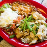 Fajitas Plate · A sizzling Southwestern specialty of lightly marinated beef or chicken cooked with thinly sl...