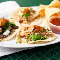 Street Taco Plate · Three small tacos served on soft corn tortillas and topped with onions, cilantro and our sup...