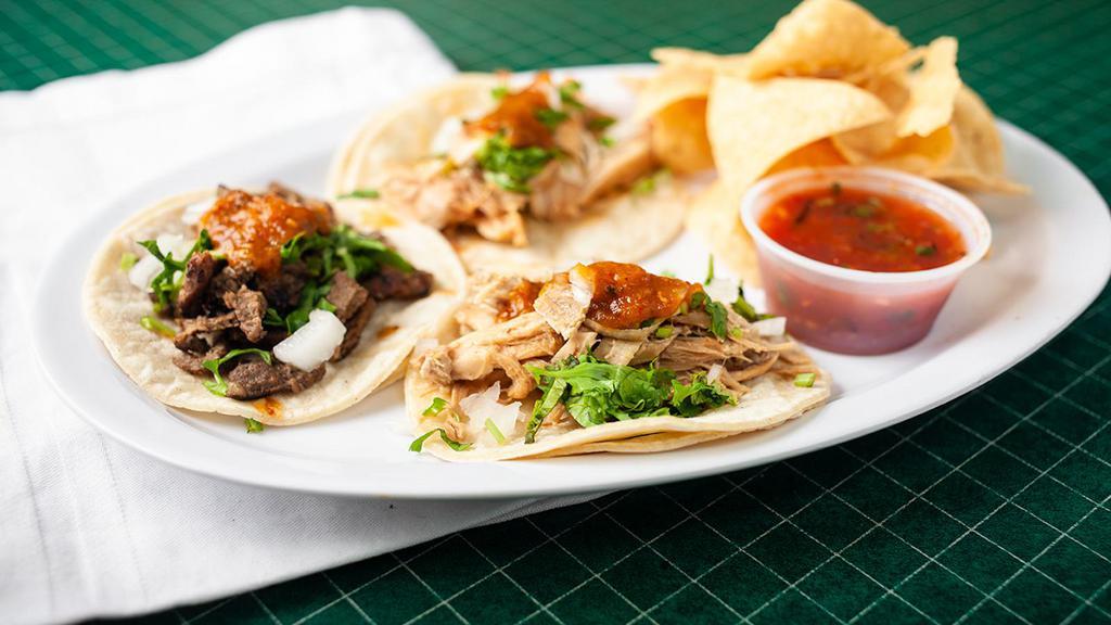 Street Taco Plate · Three small tacos served on soft corn tortillas and topped with onions, cilantro and our super spicy street taco salsa. Served with a mini chips and salsa.