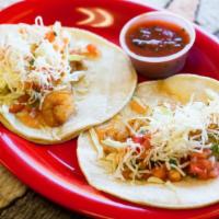 Baja Shrimp Tacos (2 Tacos) · Two soft corn tortilla tacos made with sautéed and seasoned shrimp, shredded cabbage, salsa ...