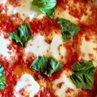 The Margherita Pizza · Tomato sauce with fresh mozzarella and fresh local basil. Cooked in the traditional Naples s...