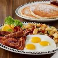 The Grizz · 2 sweet cream pancakes, 3 eggs*, 2 slices of bacon, 2 sausage links & a ham steak, served wi...