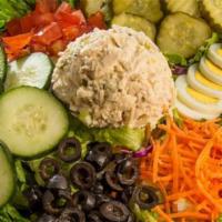 Tuna Chef Salad · Salad mix, hard-boiled egg, cucumber, carrot, olive, tomato & pickle chips topped with house...