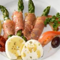 Salmone Affumicato · Fresh asparagus wrapped in smoked salmon, served with goat cheese in a honey dijon vinaigret...