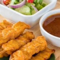 Chicken Satay (Sa-Te') · Gluten free. Chicken breast marinated with coconut milk, and curry powder, serve with cucumb...