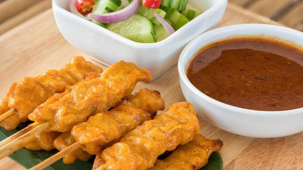 Chicken Satay (Sa-Te') · Gluten free. Chicken breast marinated with coconut milk, and curry powder, serve with cucumber salad, and peanut sauce.
