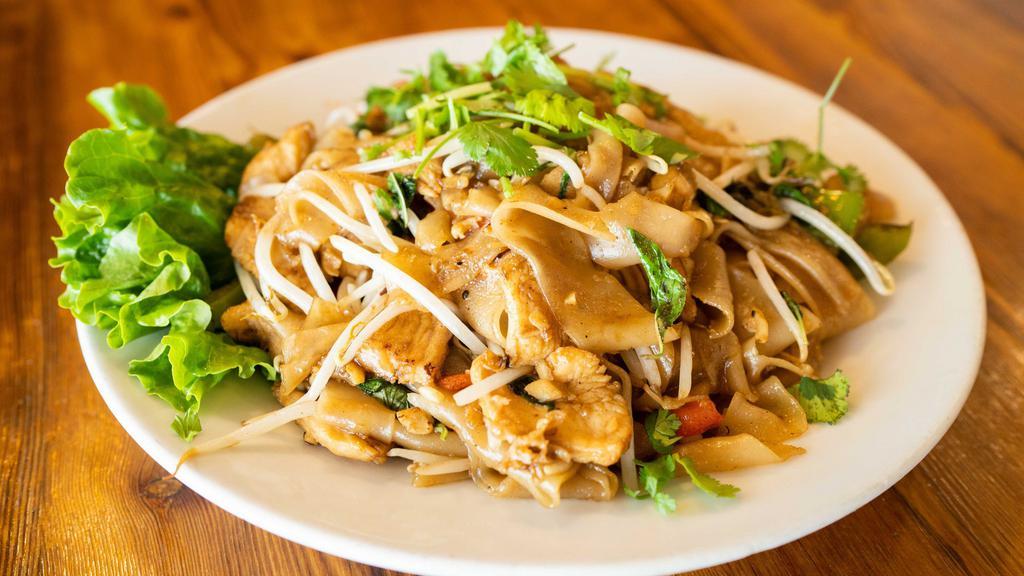 Pad Kee Mao (Drunken Noodle) · Stir - fried flat rice noodle with garlic, bell peppers(red and green), with house soy sauce, and topped with bean sprout, fresh basil leaves, cilantro  ,