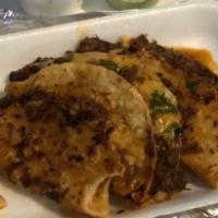 Quesataco · hand made tortilla filling with Birria, Cheddar Cheese, Cilantro, Onion comes with a side of...
