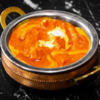 Chicken Tikka Masala · Meat. Chicken cooked with ground spices, tomatoes, bell pepper, herbs, & garlic sauce.