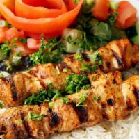 Chicken Kebab · Skewered chunks of tender marinated , chicken grilled to perfection. Served with rice, salad...